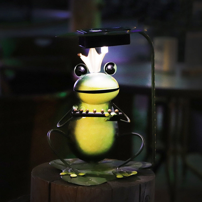 A whimsical solar-powered outdoor lawn lamp designed as a charming frog garden decoration with a ground plug. Perfect for illuminating gardens, pathways, or lawns while adding a playful touch to outdoor spaces.