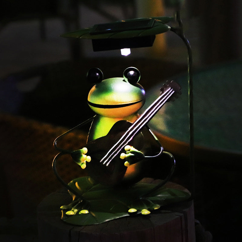 A whimsical solar-powered outdoor lawn lamp designed as a charming frog garden decoration with a ground plug. Perfect for illuminating gardens, pathways, or lawns while adding a playful touch to outdoor spaces.