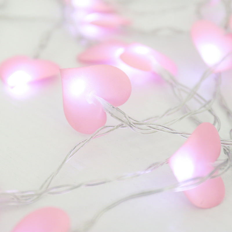 A string of warm, glowing Love Cotton lights, perfect for New Year and Christmas decor. The soft cotton spheres emit a cozy ambiance, ideal for festive celebrations and holiday decorations.