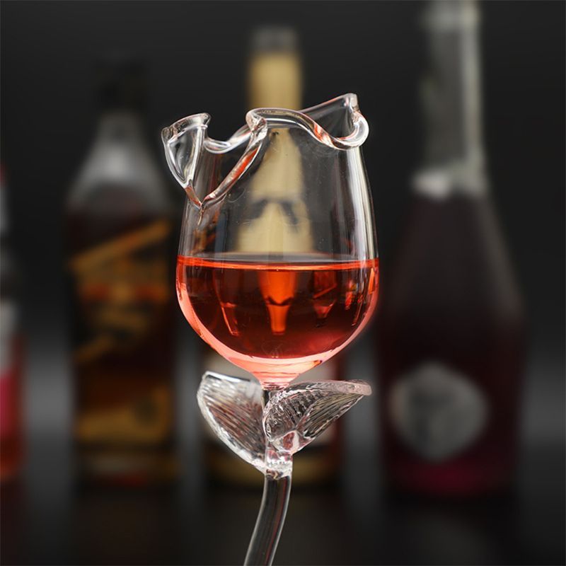 A set of elegant 100ml fancy red wine goblet glasses shaped like delicate rose flowers, perfect for parties and barware. The glasses are beautifully crafted, ideal for serving wine or cocktails, adding a touch of sophistication to any Christmas celebration.