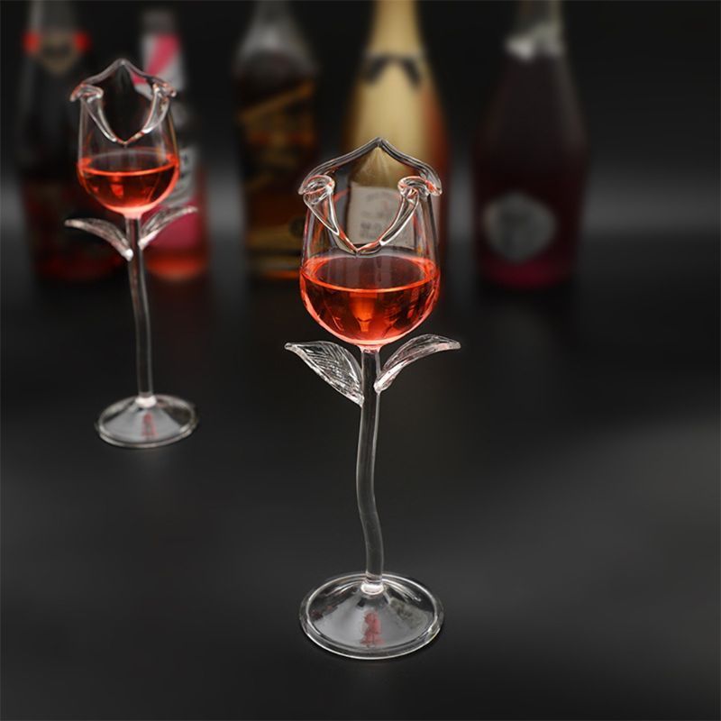 A set of elegant 100ml fancy red wine goblet glasses shaped like delicate rose flowers, perfect for parties and barware. The glasses are beautifully crafted, ideal for serving wine or cocktails, adding a touch of sophistication to any Christmas celebration.